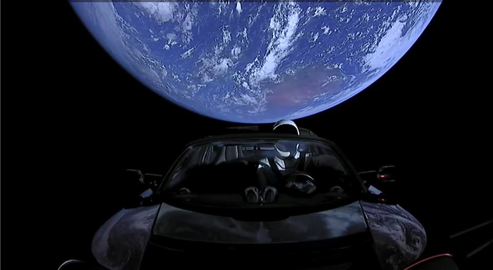 SpaceX Starman earth behind