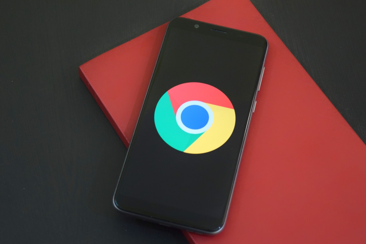 chrome emblem on the dark screen of the phone